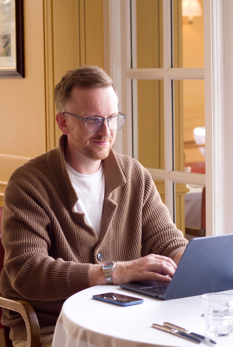 Dan Whitehouse working at his laptop